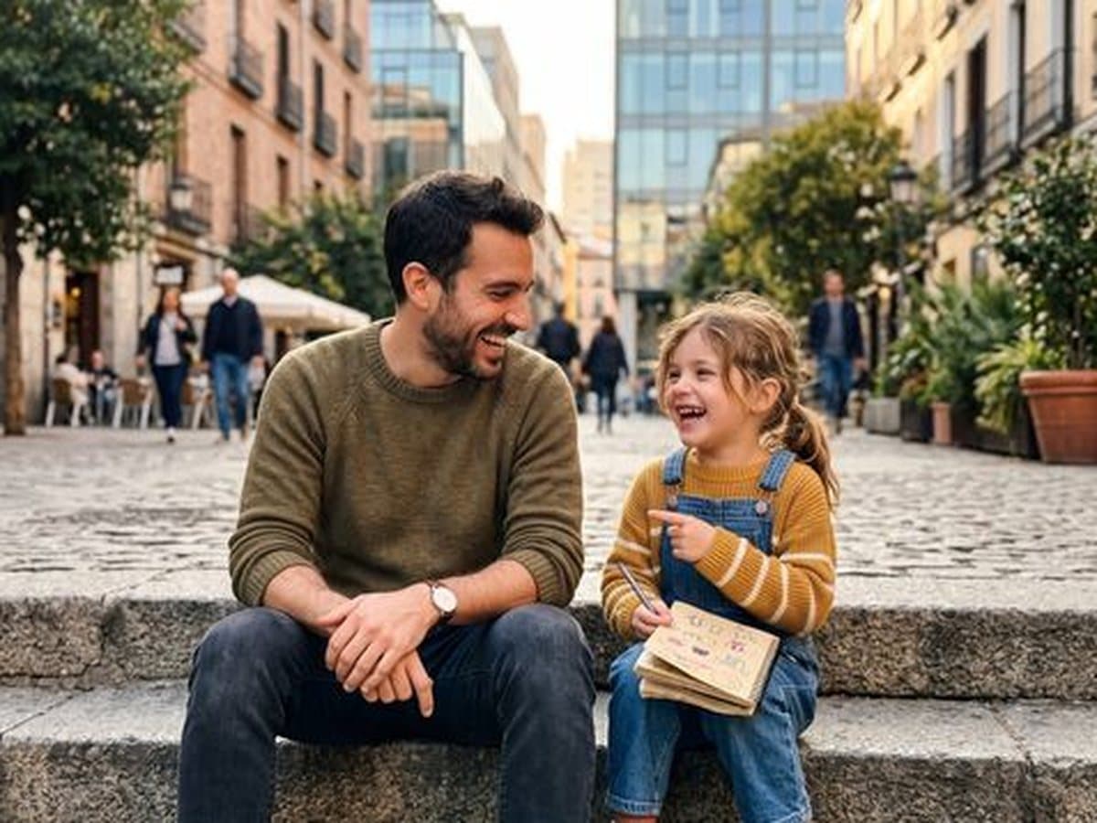 An uncle laughing with his niece on city steps